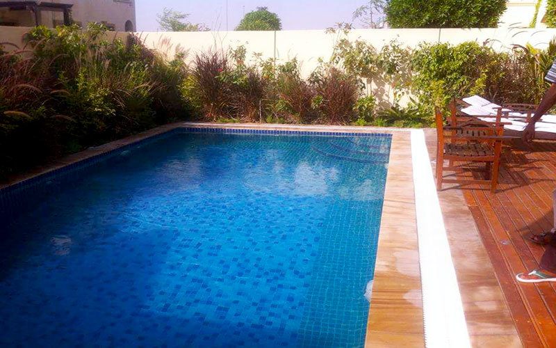 swimming pool with wooden decking system